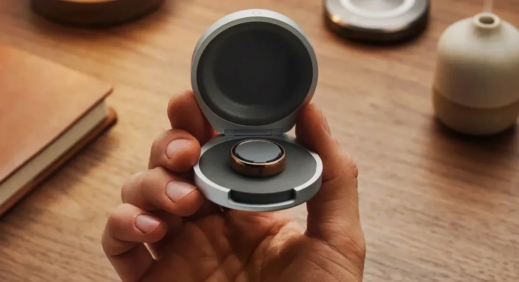 A studio comparison shot showing the profile thickness of the Oura Ring 4 next to the significantly slimmer 2.28mm profile of the new Oura Ring 5.
